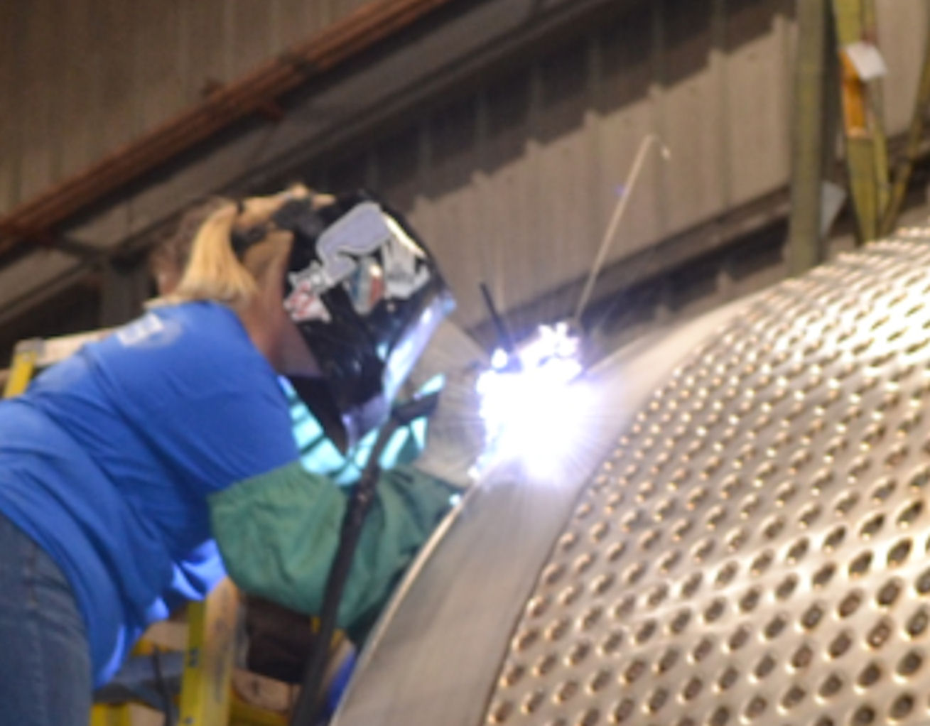 Apprentice welder learns on the job